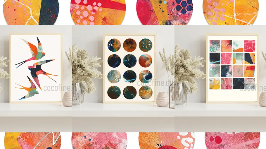 Three framed abstract artworks on shelf.