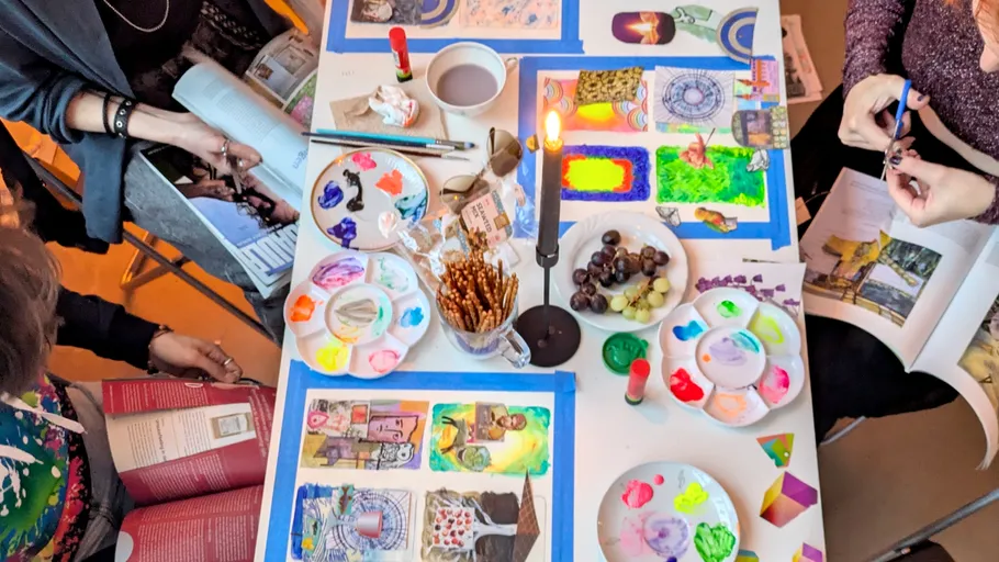 Art supplies and snacks on a table.