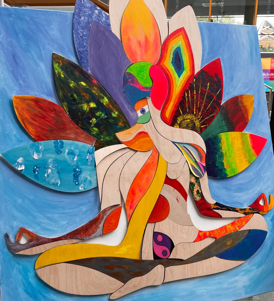 Colorful abstract art depicting a seated figure.