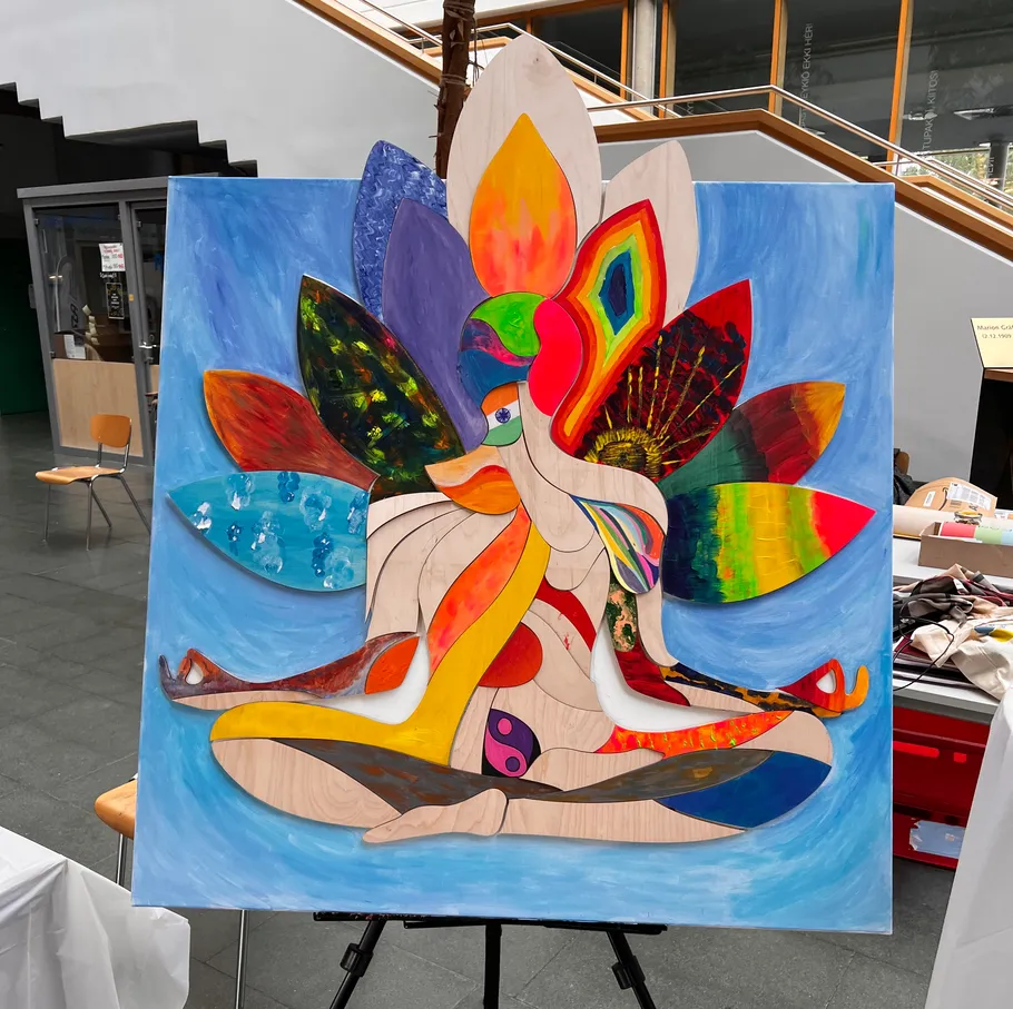 Colorful abstract painting of seated figure indoors.