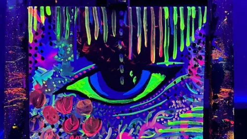 Neon abstract art with eye in dark room.