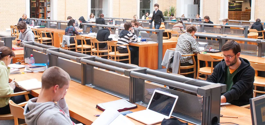 People studying in a busy library.