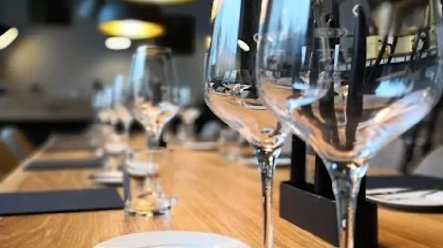 Empty wine glasses on a wooden table.