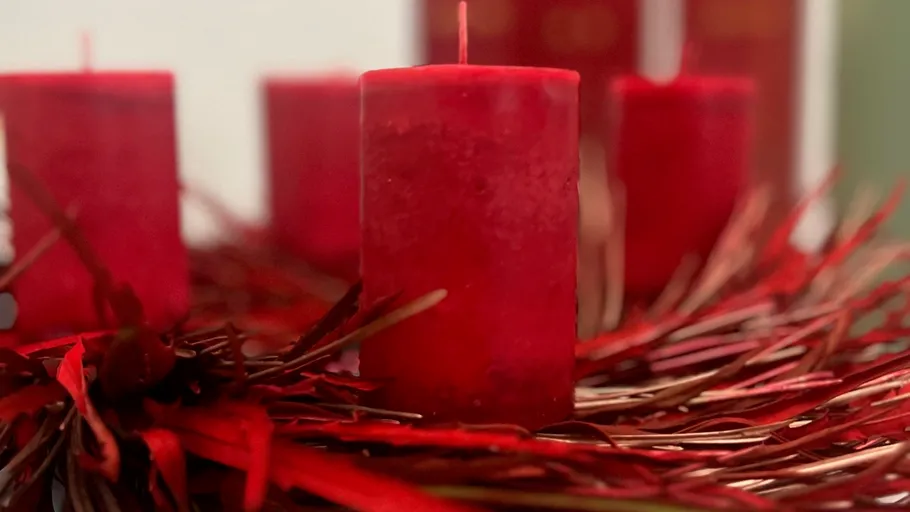 Red candles on an Advent wreath.