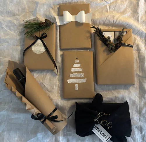 Books wrapped in brown paper with decorations.