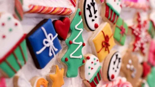 Colorful Christmas cookies on display table.