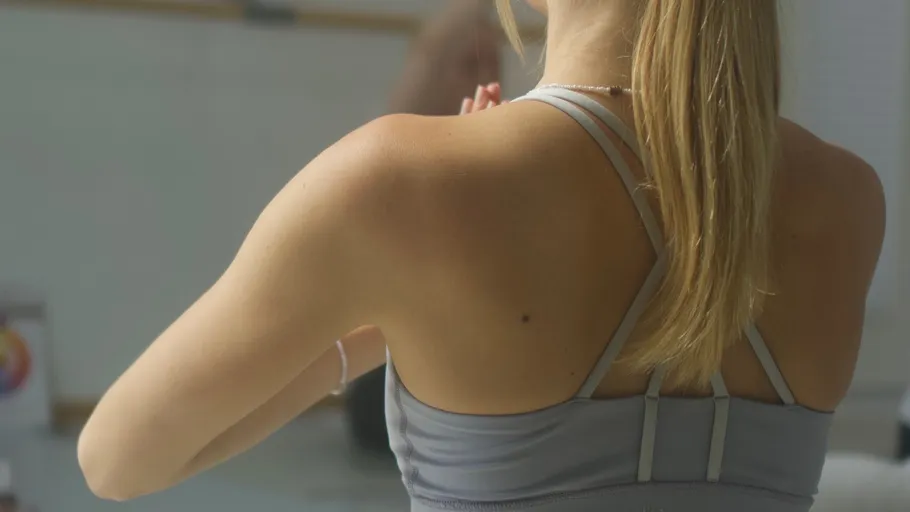 Woman doing yoga pose in studio.