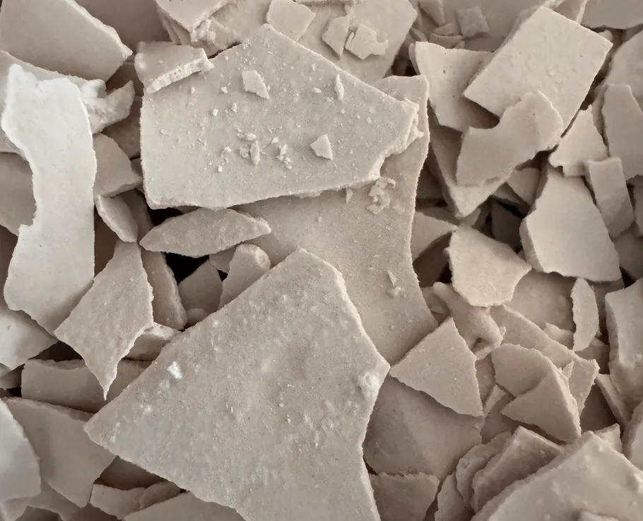 Close-up of beige broken plaster pieces.