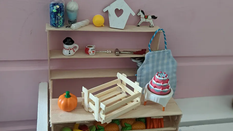 Miniature shelf with tiny kitchen items.