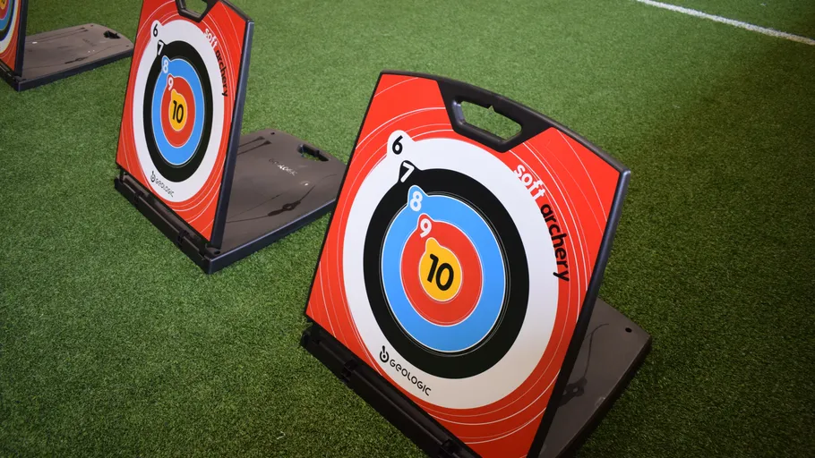 Archery targets on green artificial turf.