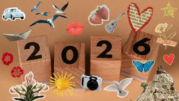 Wooden blocks showing 2026, surrounded by stickers.