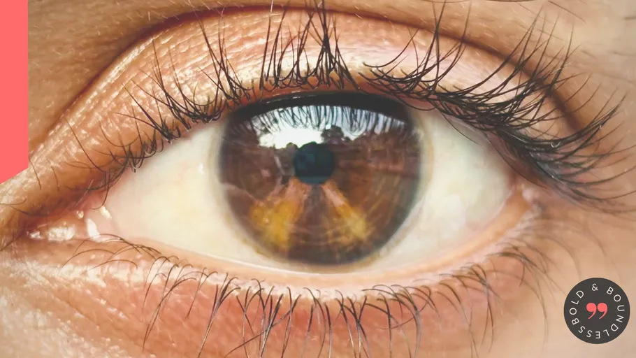 Close-up of eye with reflection visible.