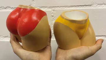 Colorful swimsuit-shaped planters held by hands.