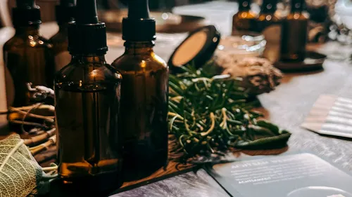 Brown glass bottles on a wooden table.