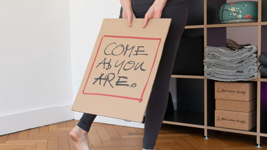 Person holding sign in yoga studio.