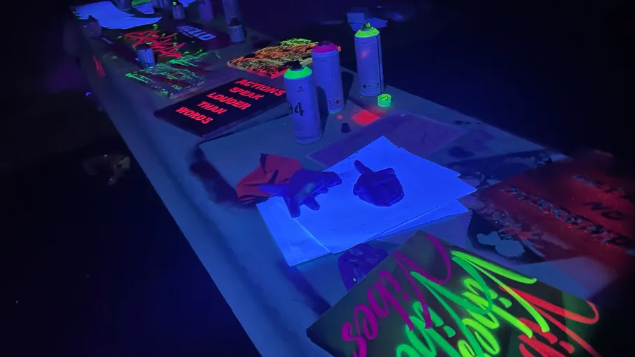 Neon-painted items glow under ultraviolet light.