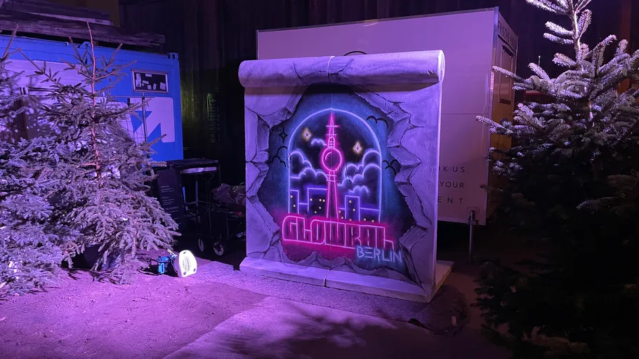 Neon sign with Berlin skyline at night.