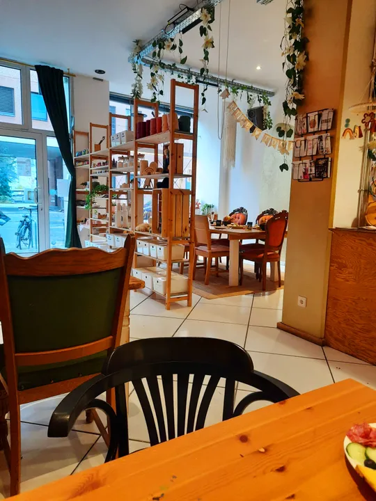 Cozy café with wooden furniture and decorations.