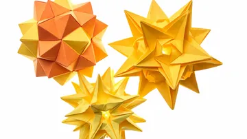 Three origami stars on white background.