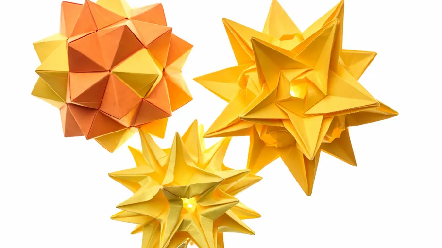 Three origami stars on white background.