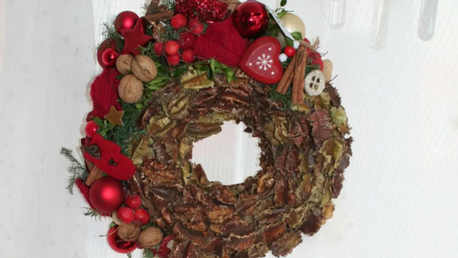 Decorative festive wreath on white background.