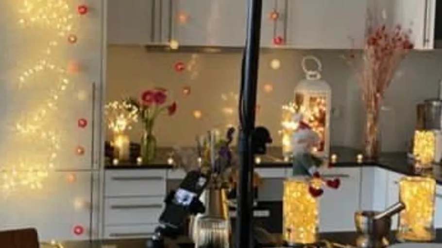 Decorated kitchen with lights and flowers.