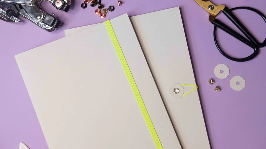 Two folders with tools on purple background.