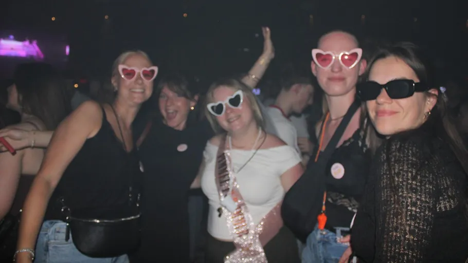 Group of women dancing at nightclub.