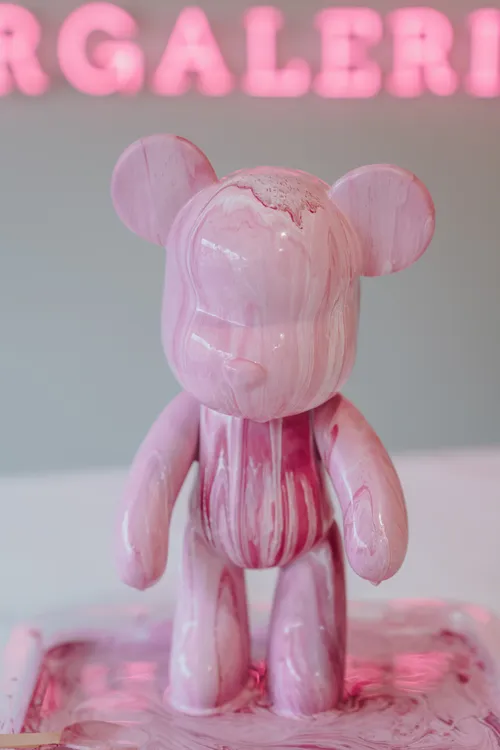Pink bear sculpture with pink background.