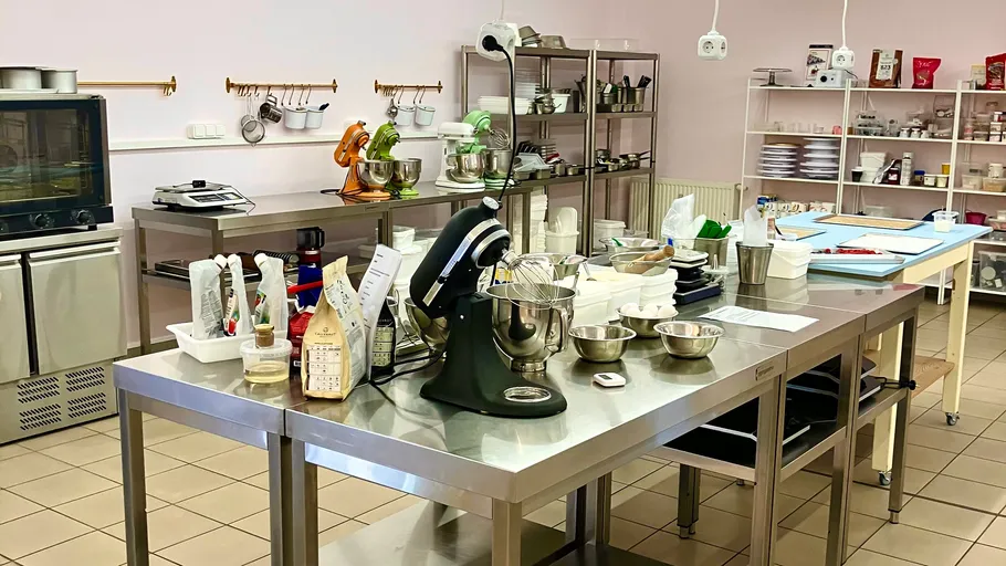 Large kitchen with mixers and baking supplies.