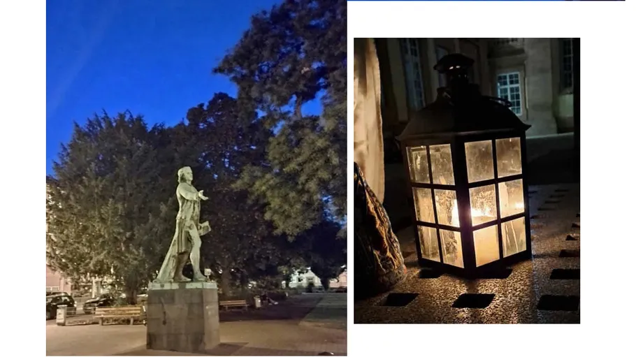 Statue at dusk; candlelit lantern.
