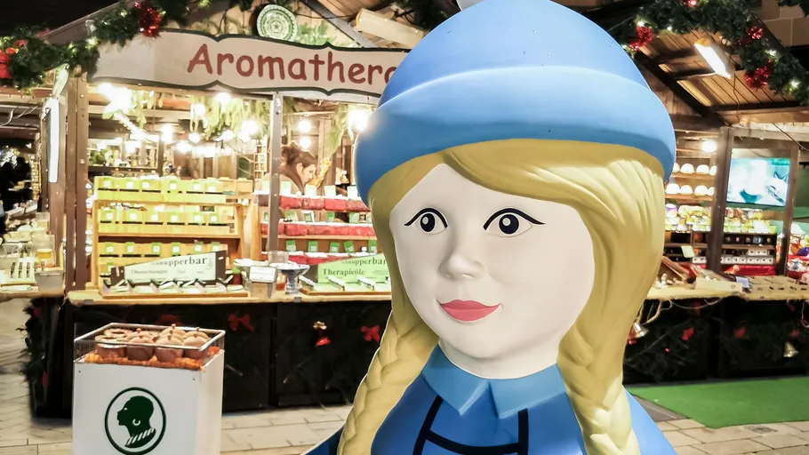 Statue of woman in front of aromatherapy stall.