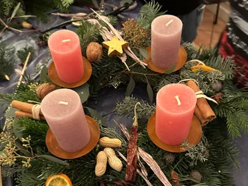 Advent wreath with four red candles.