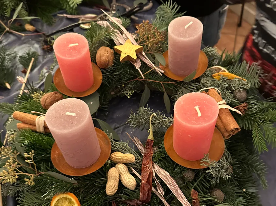 Advent wreath with four red candles.