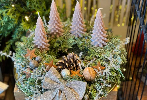 Advent wreath with candles and Christmas decorations.