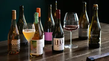 Non-alcoholic beverages displayed on a wooden table.