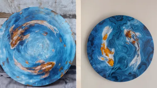 Two round abstract paintings with blue swirls.