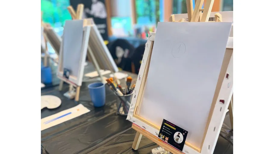 Blank canvases on easels in art class.