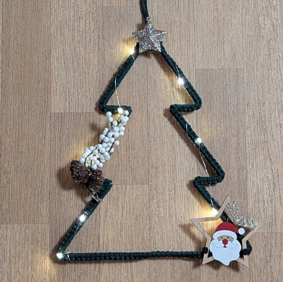 Decorative Christmas tree with lights on floor.