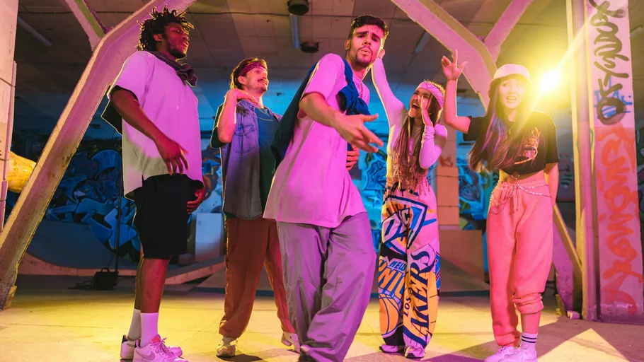 Group of dancers posing in urban setting.