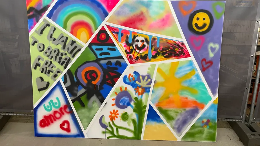 Colorful abstract painting with various shapes and symbols.