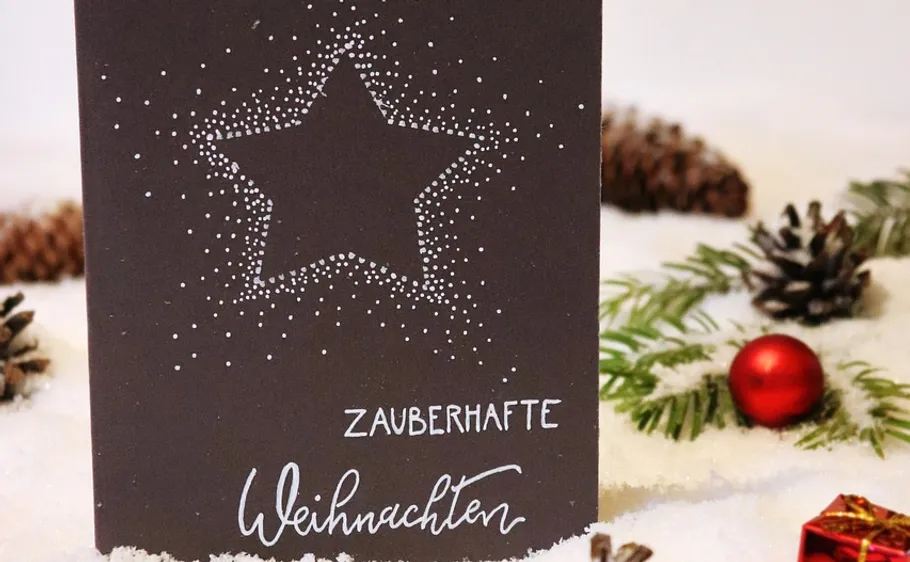 Christmas card with star and festive decoration.