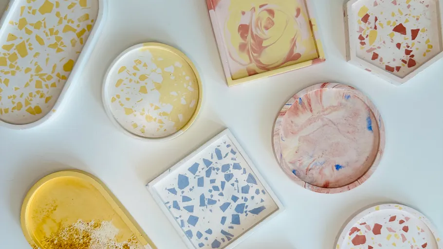 Colorful terrazzo coasters arranged on a table.
