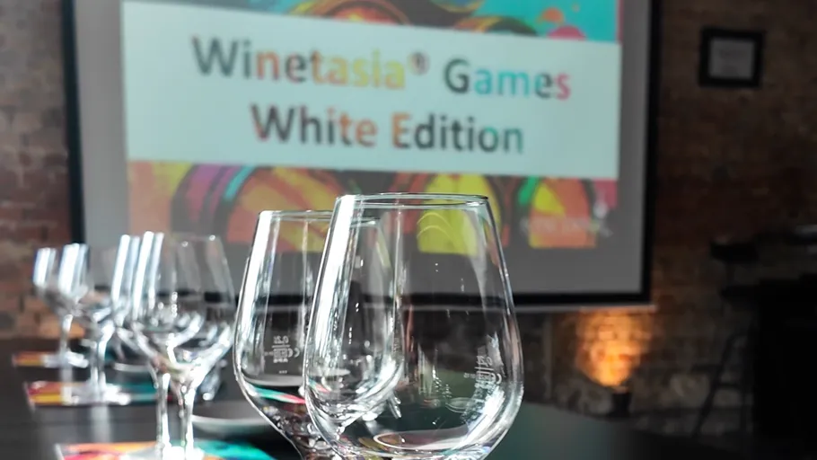 Empty wine glasses with event sign background.