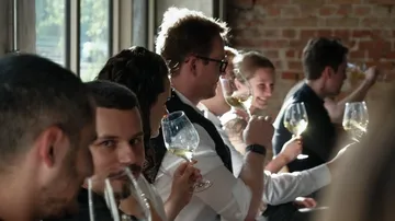People drinking wine in a restaurant.