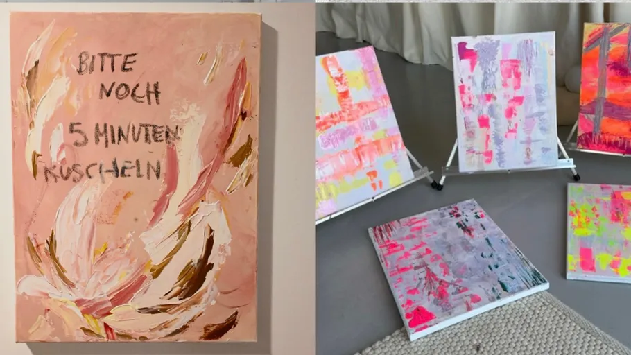 Colorful abstract paintings displayed on floor and easel.