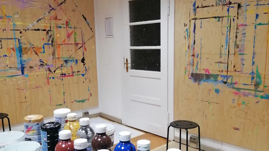 Paint bottles on table in art studio.