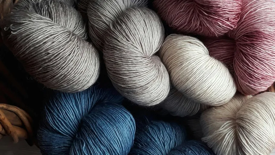 Colorful yarn skeins displayed together.