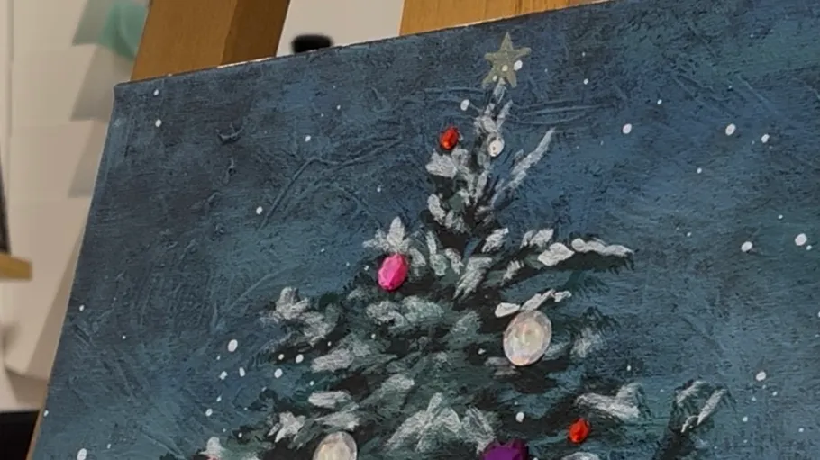 Painted Christmas tree with colorful ornaments.