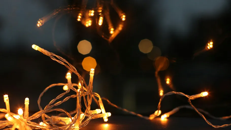 String lights glowing in a dark room.